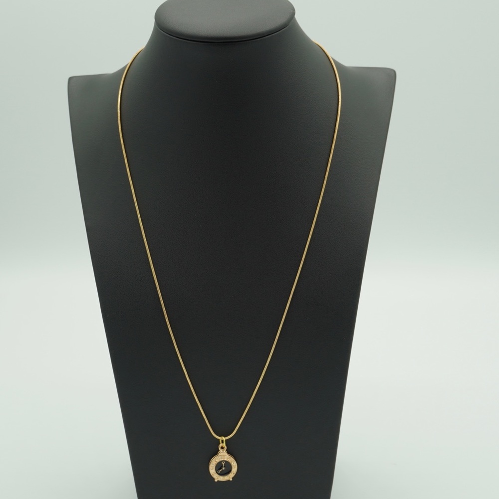Gold necklace with a watch pendant